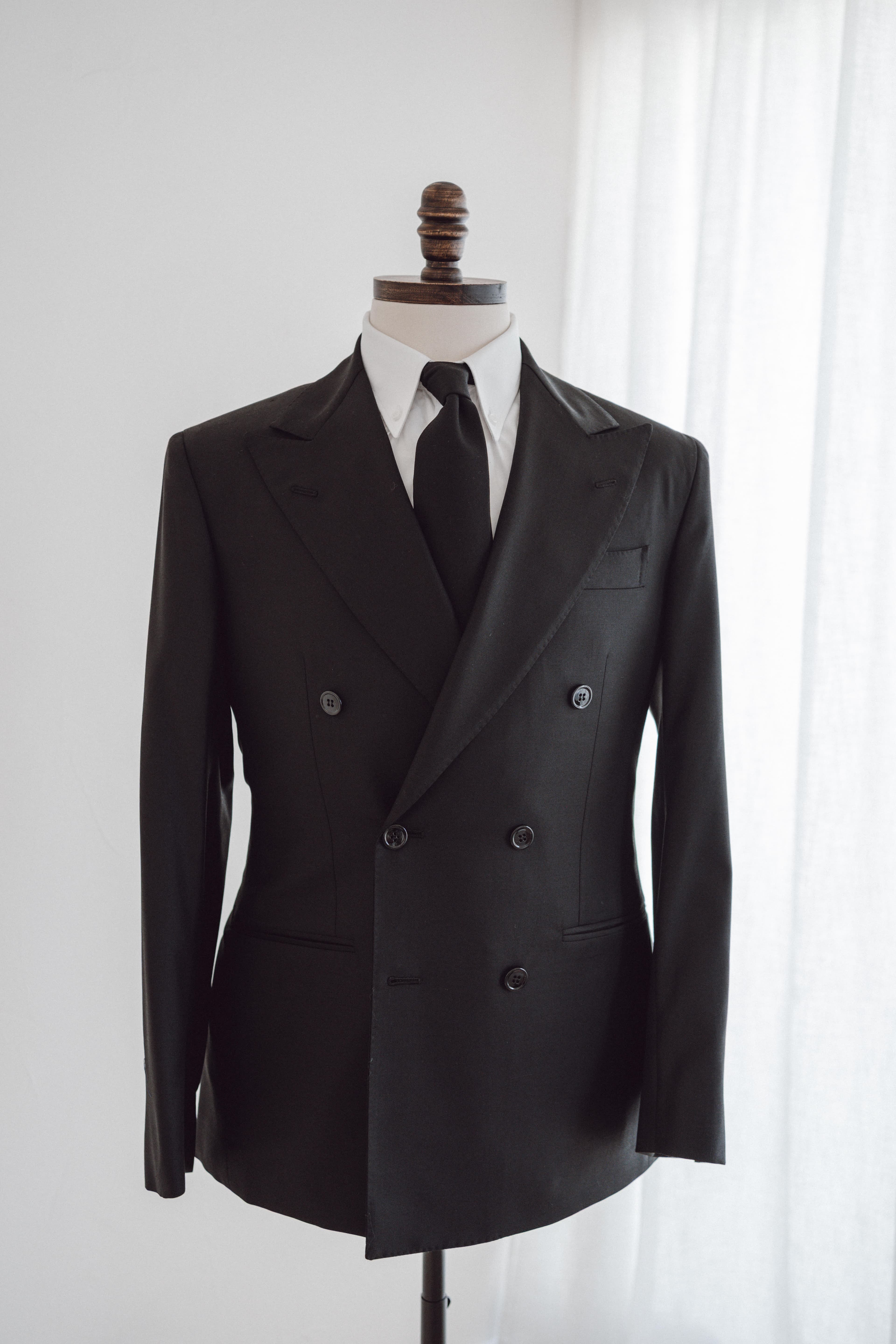 Bespoke double-breasted tuxedo on mannequin by FK Bespoke